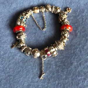 Pandora Bracelet, all charms 14 k and silver sizem